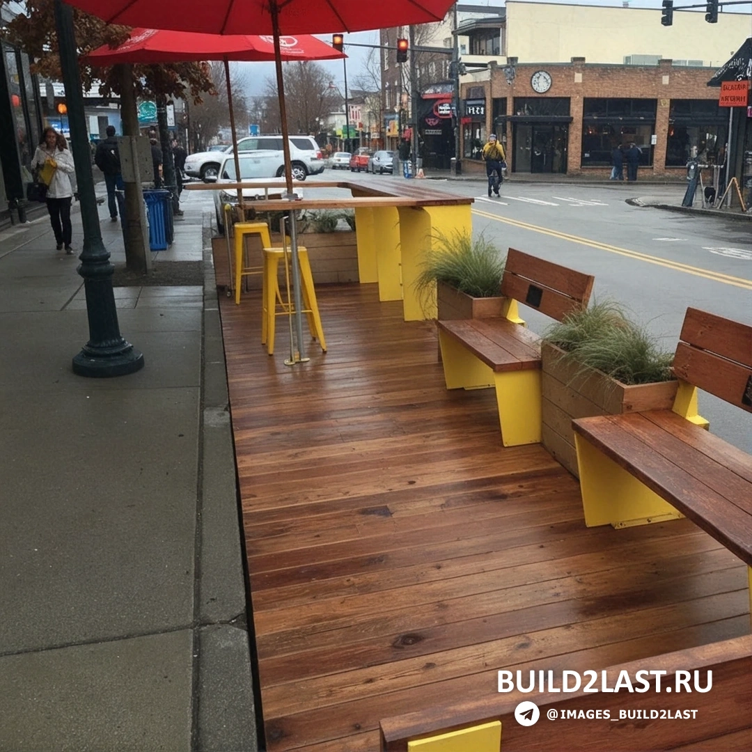 Парклет с оранжевыми акцентами на тротуарной плитке и доске.