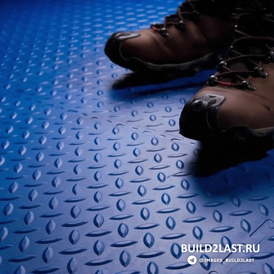 ПВХ покрытие для пола с синим и серым цветами, выполненное из пластика/полимеров.